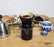 pour over plastic coffee filter number 1 size black sitting on coffee mug