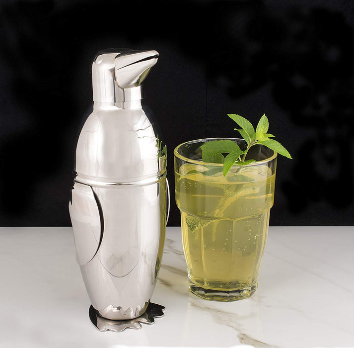 penguin cocktail shaker next to mint julep