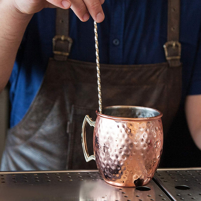 copper moscow mule hammered mug on bar