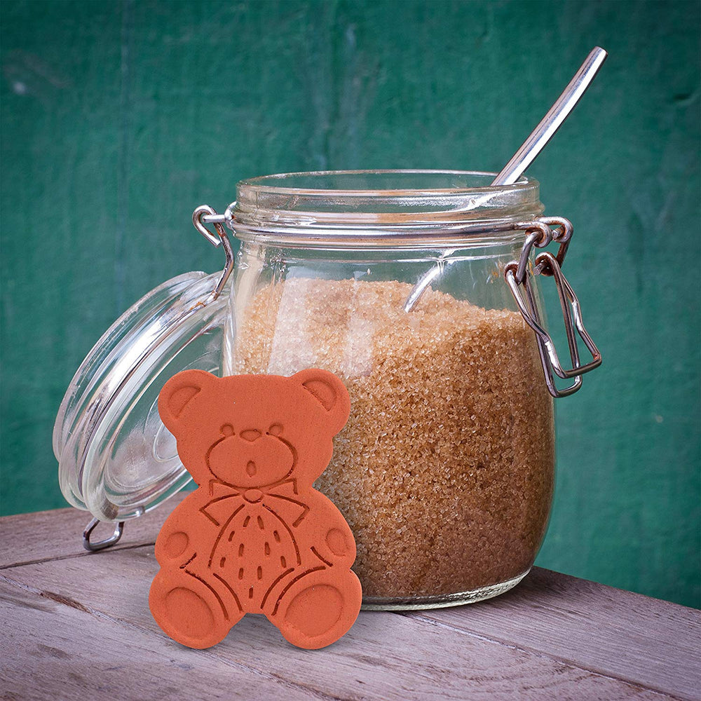 brown sugar bear brown sugar softener in front of a jar of brown sugar